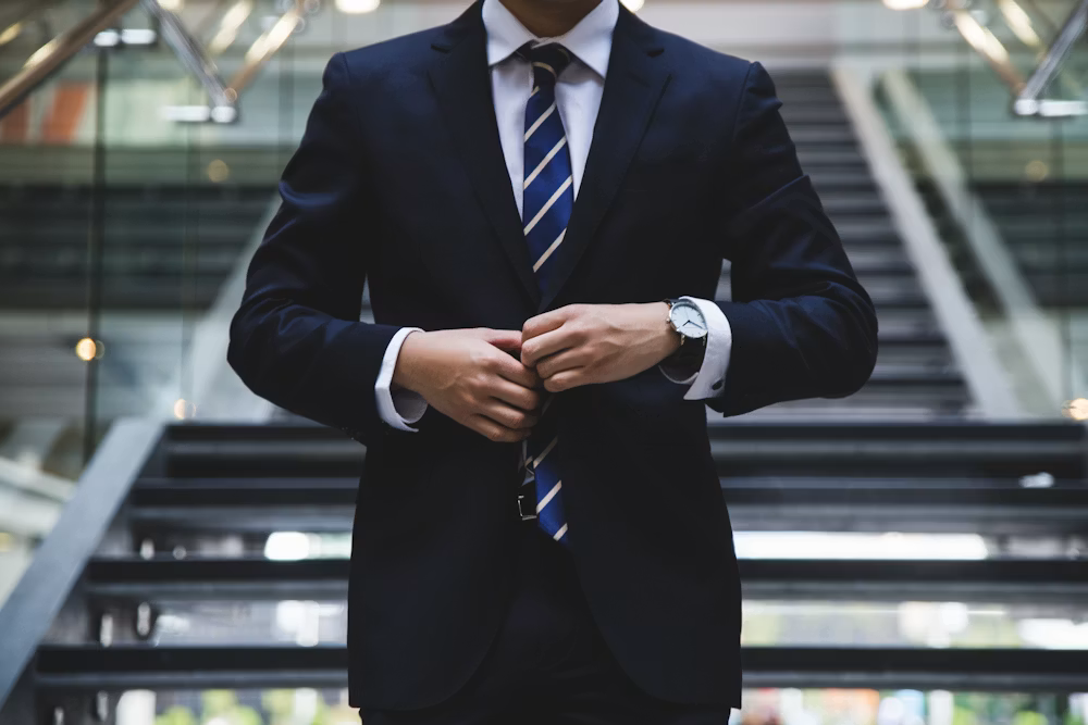 Financial professional analyzing reports at a desk