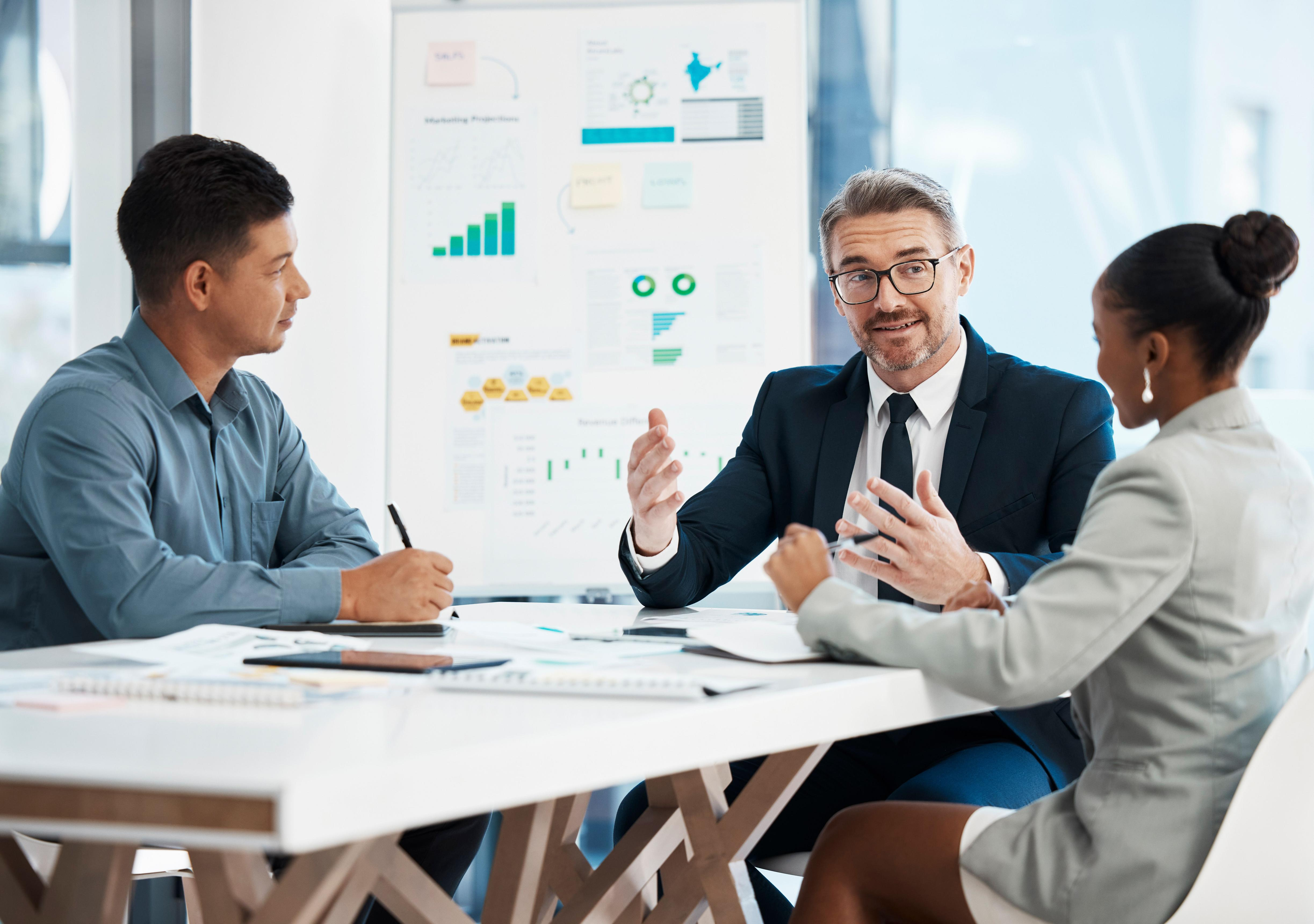 Financial charts and data displayed across multiple screens