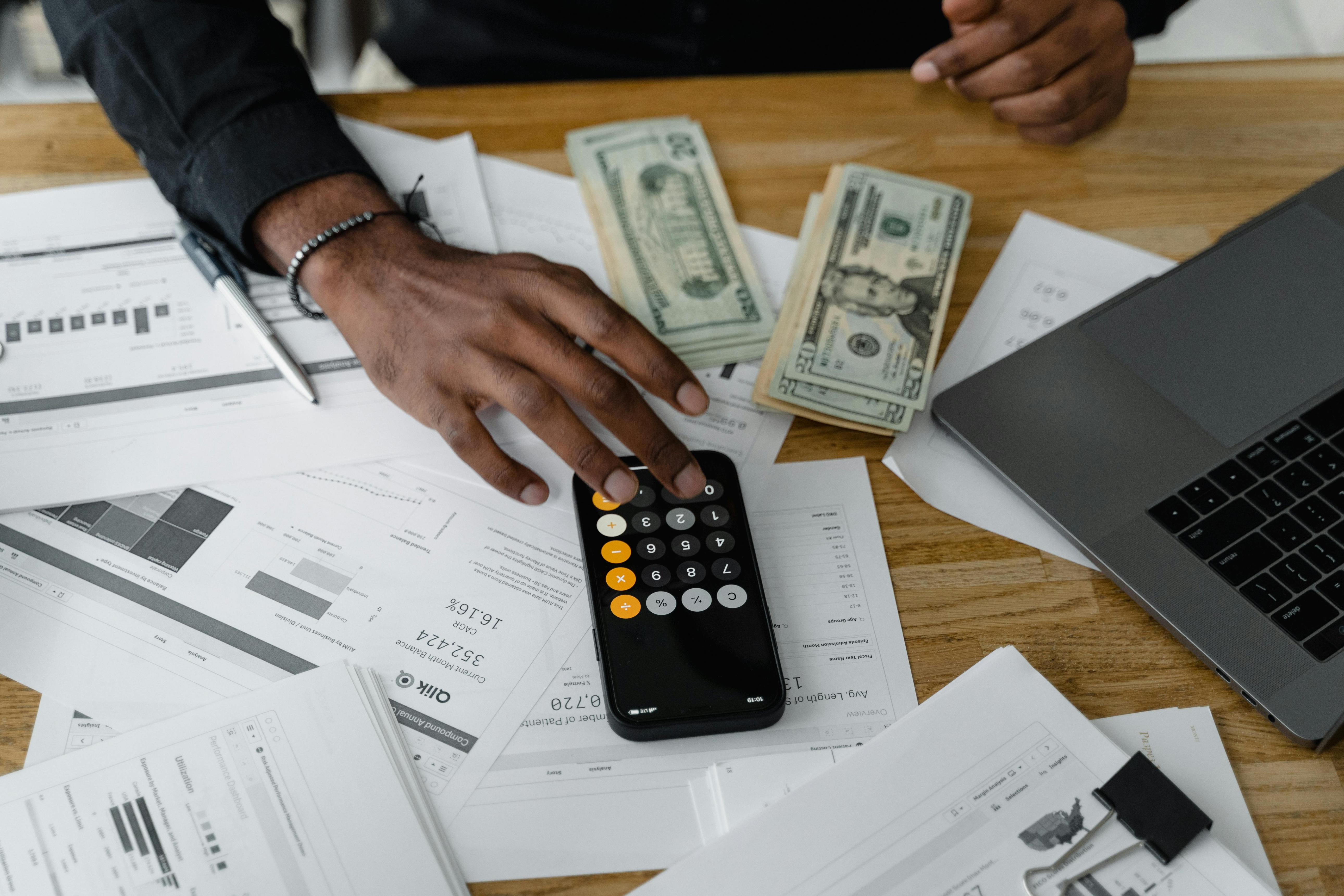 Financial planning documents and calculator on a desk
